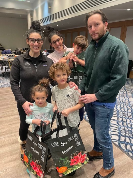 The Levin-Hunziker family at a holiday volunteer event.