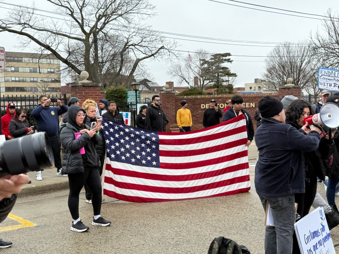 People held flags at the rally.