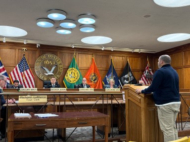Oyster Bay Town Supervisor and the town board approved tax exemptions for disabled veterans and spouses of killed police officers.