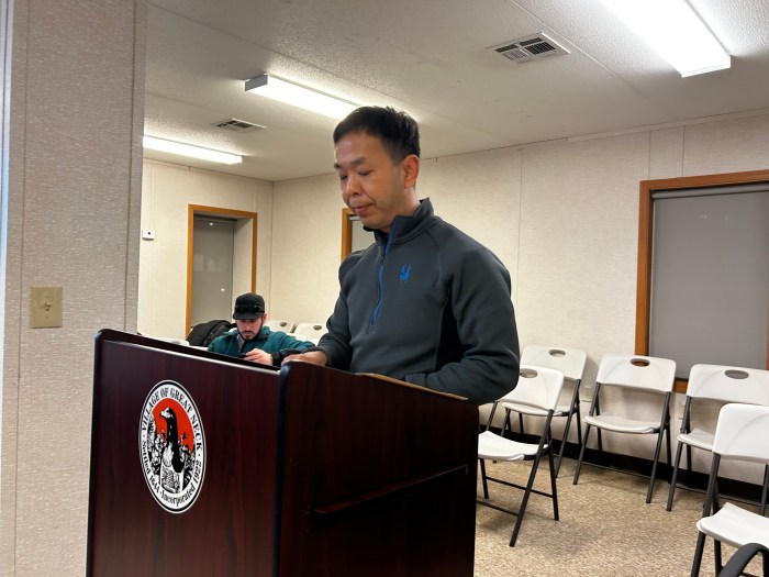 Guofeng Lu petitions the board of trustees to lower Building Department fees.