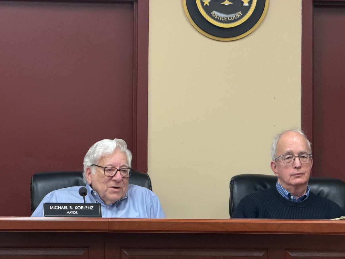 Village of East Hills Mayor Michael Koblenz (L.) and Trustee Emmanuel Zuckerman (R.) discussed the need for a bond for the new village playground.
