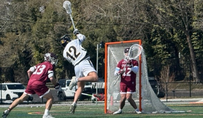 St. Anthony’s senior attacker, Charlie Cacciabaudo, rises up for a shot on goal.