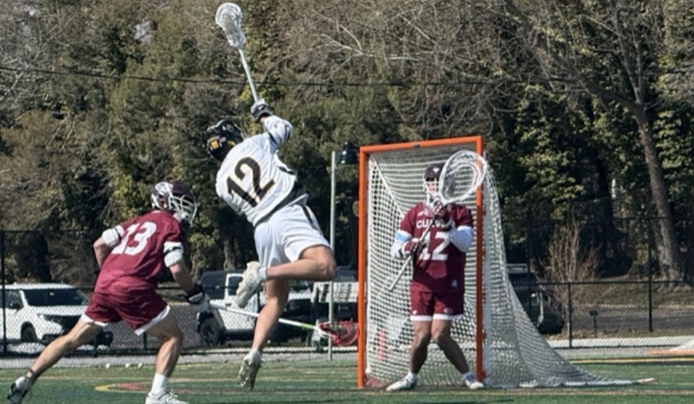 St. Anthony’s senior attacker, Charlie Cacciabaudo, rises up for a shot on goal.
