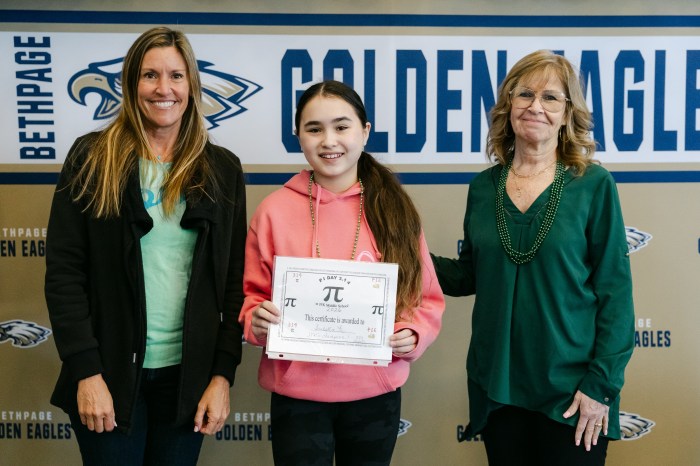 Isabella Fu claimed the title of JFK Pi Day Champion – and broke the school record– by reciting an extraordinary 393 digits of pi from memory.