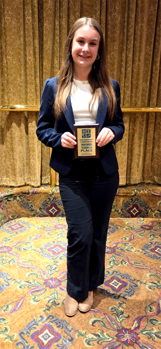 North Shore student with her award from the Long Island Science Fair.