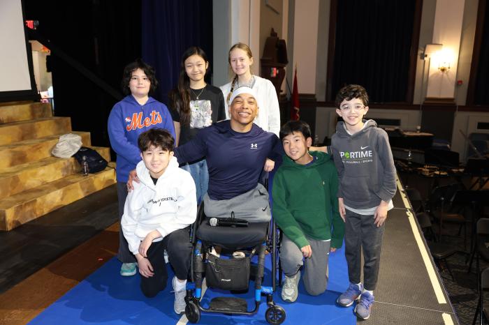Rohan Murphy with students at Carrie P. Weber Middle School.