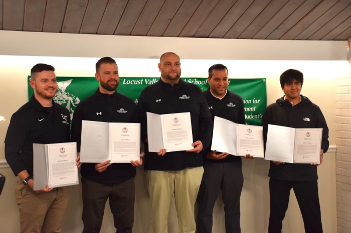 Coaches showed their Lifesaving Awards certificate from the American Red Cross.