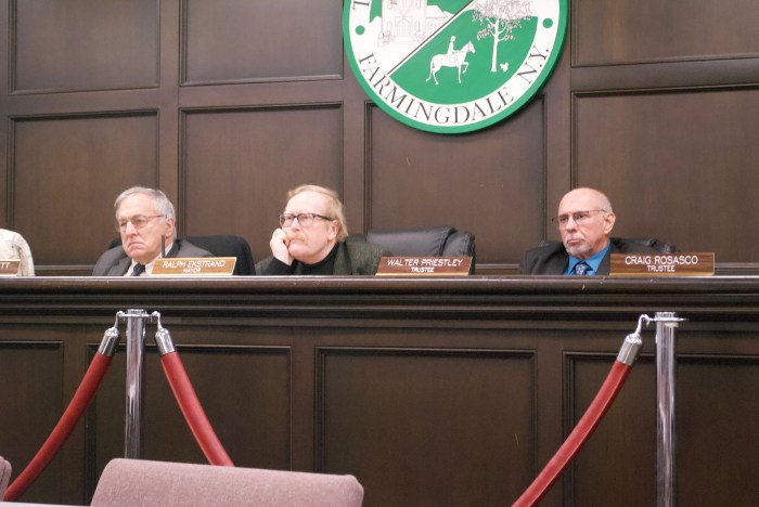 Farmingdale Village Mayor Ralph Ekstrand (C.) and the village board approved the $650,000 purchase of a property.