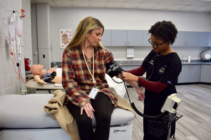 Students took blood pressure readings.