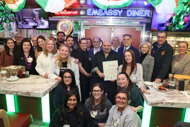 Oyster Bay Town Supervisor Joseph Saladino, St. Joseph Hospital President Joseph Manopella, Nassau County Comptroller Elaine Phillips and Oyster Bay Town officials recognizing Embassy Diner owner Gus Tsiorvas for donating breakfast for 80 frontline workers during aa recent winter storm.