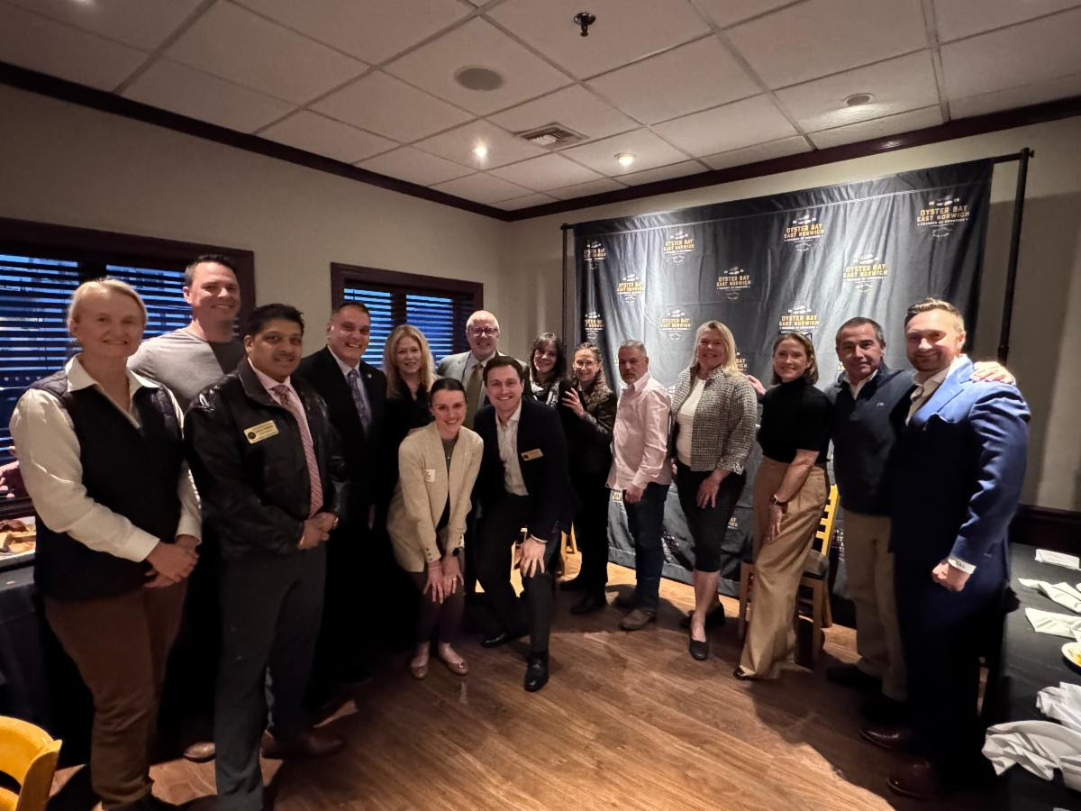 Oyster Bay Town Supervisor Joseph Saladino (C.) and members of the Oyster Bay-East Norwich Chamber of Commerce at a recent event.