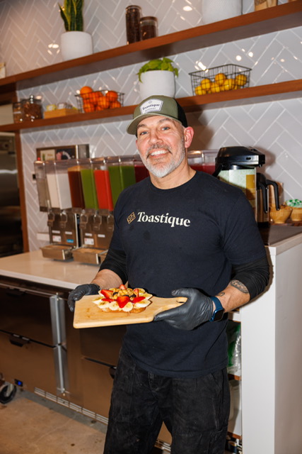 Co-owner Chris Pedersen prepares the goods at gourmet juice bar Toastique.
